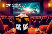 ID: CA350 – KKarta Credit Agricole i Cinema City z grafiką klapsa filmowego wokół którego lata popcorn po niebieskich orbitach. W tle jest sala kinowa.